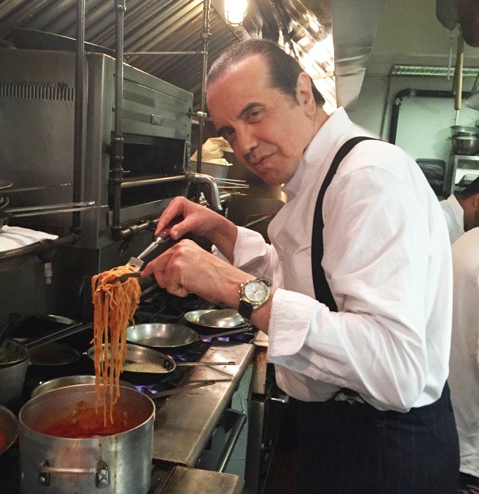 Chazz Palminteri making spaghetti in the kitchen of his popular New York City restaurant.