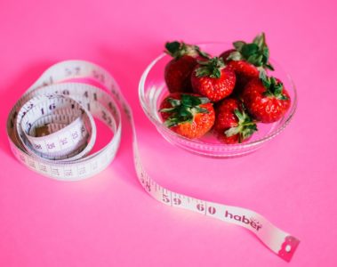 Strawberries and measuring tape.
